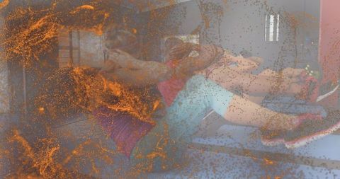 Performing partner core workout on benches wearing bright activewear with orange overlay