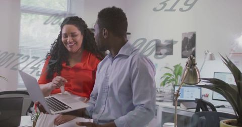 Team Collaborates on Data Analysis in Modern Office