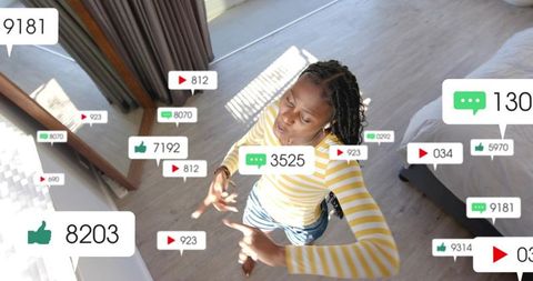 Creative social media influencer dancing amid engagement symbols