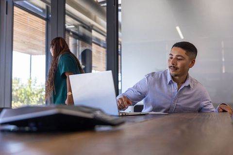 Diverse professionals engaging in productive office interaction