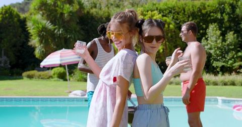 Diverse Friends at Poolside Gathering with Refreshing Drinks