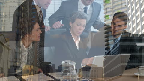 Diverse Business Team Collaborating with Cityscape Overlay