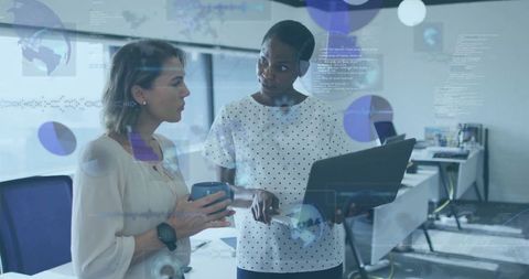 Professionals Analyzing Data with Digital Interface in Modern Office