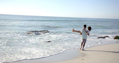 Romantic Beach Day with Couple Having Fun Together on Shoreline - Download Free Stock Images Pikwizard.com