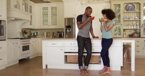 Couple Enjoying Relaxing Morning Drink in Cozy Kitchen