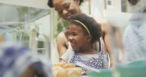 Happy Family Enjoying Outdoor Breakfast Gathering