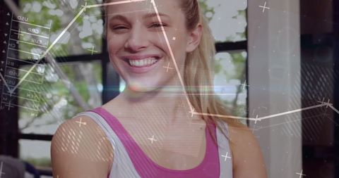 Caucasian Woman in Gym with Financial Data Overlay