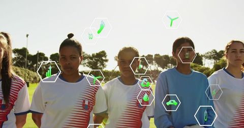 Female soccer team standing in lineup with goalkeeper holding ball and analytics overlays