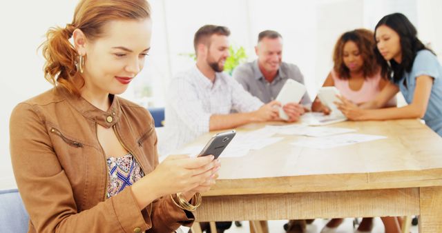 Group of Diverse Colleagues Using Smartphones and Tablets in Modern Office - Download Free Stock Images Pikwizard.com