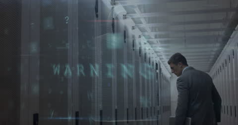 Businessman in Server Room Analyzing Data Security
