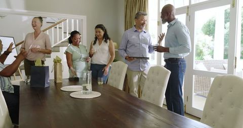 Diverse Senior Group Enjoying Celebration at Home