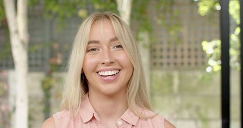 Bright Smiling Woman in Patio Environment