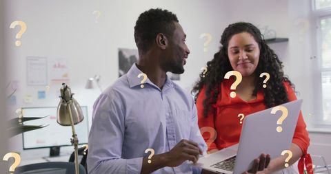 Colleagues Brainstorming with Technology in an Office Environment