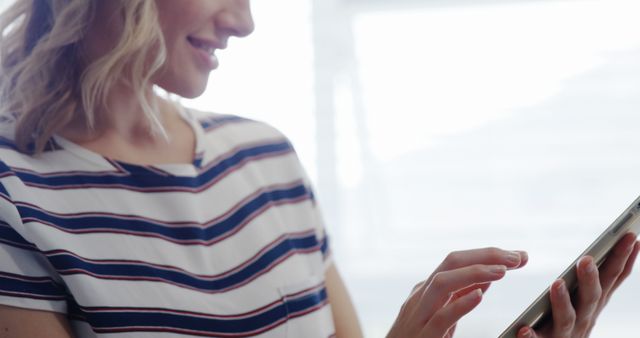 Smiling Woman Using Smartphone in Striped Shirt - Download Free Stock Images Pikwizard.com