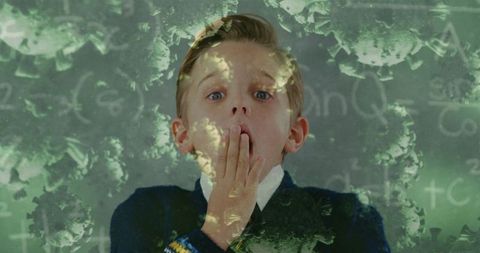 Surprised Schoolboy with Coronavirus Overlays in Classroom - Download Free Stock Images Pikwizard.com