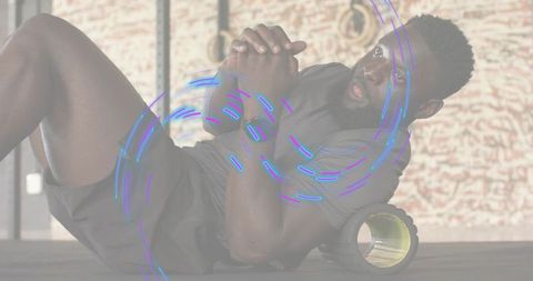 Athlete using foam roller for core mobility and recovery with neon motion graphics