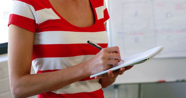 Person Writing Notes on Notepad in Bright Office - Download Free Stock Images Pikwizard.com