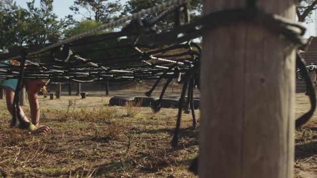 Caucasian teenagers participate in an engaging bootcamp training session outdoors, focusing on teamwork and physical fitness. Essential image for materials encouraging youth fitness programs, adventure sports activities, or team-building exercises.