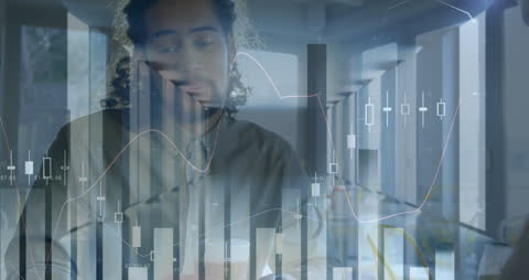 Businessman Analyzing Financial Data with Graphs in Modern Office
