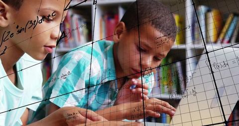 Young students solving equations with overlayed mathematical graphs