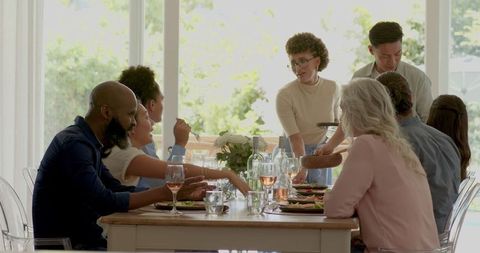 Elegant wedding reception with focused serving staff