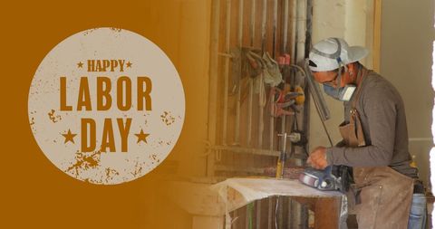 Labor day celebration with skilled male carpenter in workshop