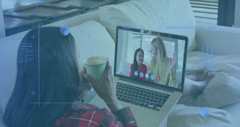 Woman video calling with digital interface overlay