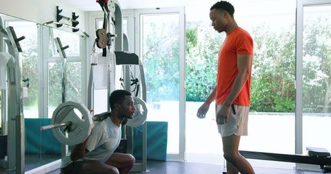 Fitness Enthusiasts Exercising Together in Home Gym