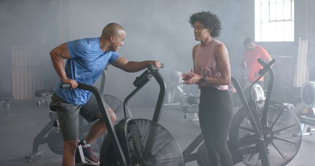 Fitness Instructor Guiding Client During Intense Workout in Smoky Gym - Download Free Stock Images Pikwizard.com