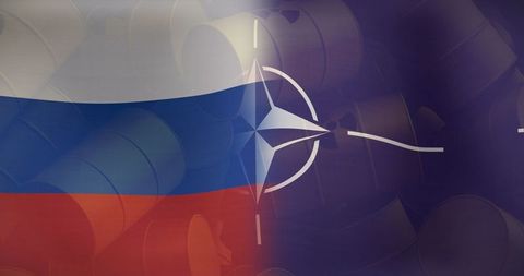 Russia and nato flags with radioactive barrels indoors