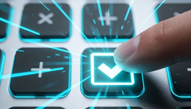 Futuristic fingertip pressing illuminated checkmark key on backlit metal keypad with cyan glow