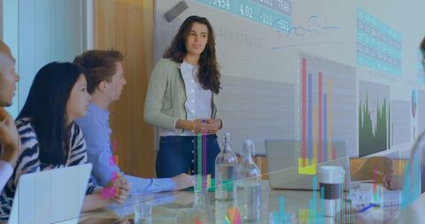 Diverse team analyzing financial data during business meeting