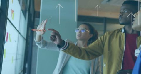 Diverse Professionals Analyzing Data on Digital Screen