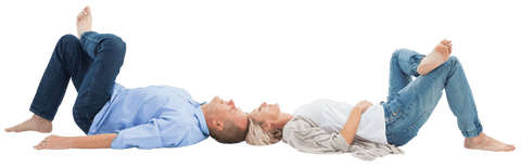 Mature couple lies on floor smiling and showing close connection in casual setting. Ideal for advertisements or articles about comfortable homemaking, aging happily together, relationship tips, and lifestyle content focusing on mature audiences with a theme of joy and companionship.