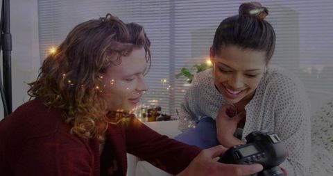 Young Adults Collaborating on Photography Project at Home