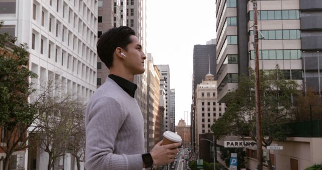 Young Professional Enjoying Coffee in Urban Landscape - Download Free Stock Images Pikwizard.com