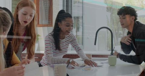Young team collaborating over color palette on kitchen island planning creative project
