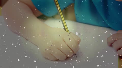 Child Writing in School with Confetti Overlay