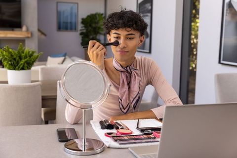 Man Practicing Makeup Skills in Stylish Home Environment