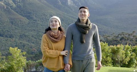 Couple Enjoying Tranquil Walk in Mountain Scenery