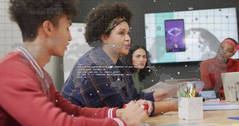 Young woman leading tech workshop with diverse team in modern collaborative classroom