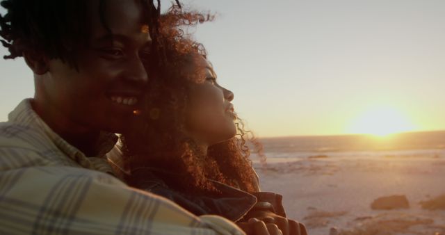 Couple Embracing at Sunset on Beach - Download Free Stock Images Pikwizard.com