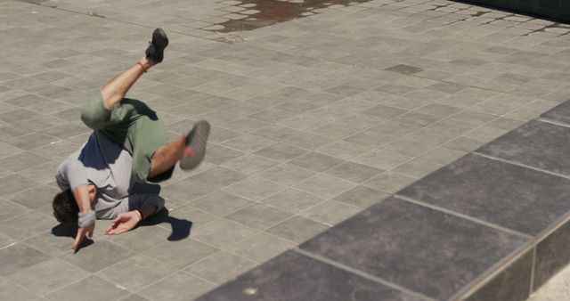 Urban Parkour Athlete Performing Dynamic Flip on Concrete Surface - Download Free Stock Images Pikwizard.com