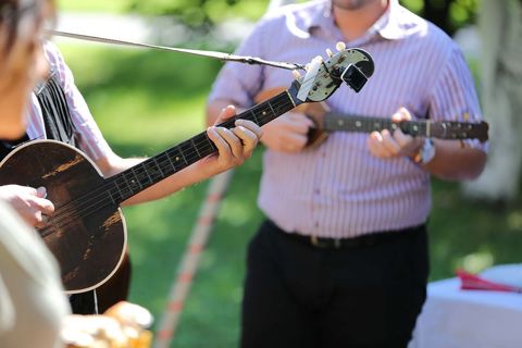 Musicians performing outdoors at daytime event