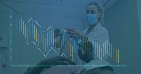 Masked Dental Professional Examining Patient with Modern Charts