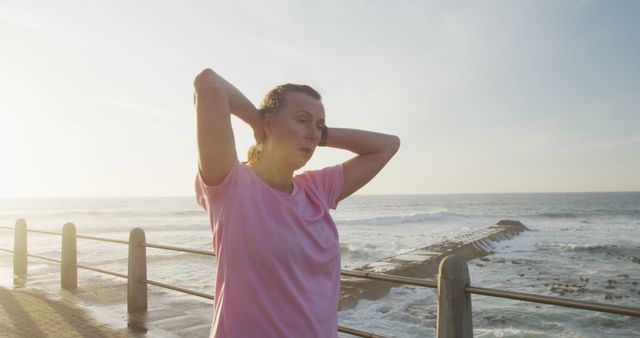 Woman Cooling Down After Exercise Near Ocean Waterfront - Download Free Stock Images Pikwizard.com