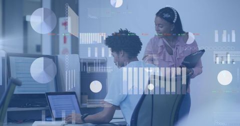 Diverse Professionals Collaborating in Modern Office with Digital Analytics