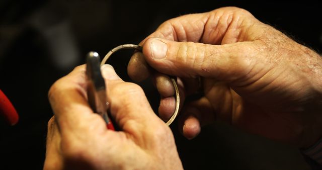 Elderly hands crafting handmade jewelry in workshop - Download Free Stock Images Pikwizard.com