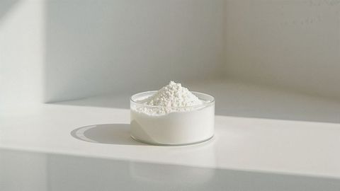 Curated glass dish filled with milk powder