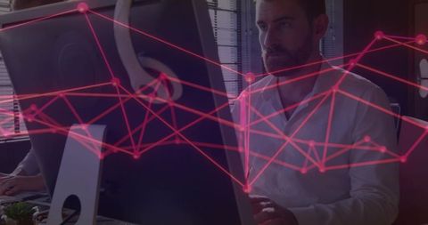 IT Professional Analyzing Digital Data Network at Office Desk